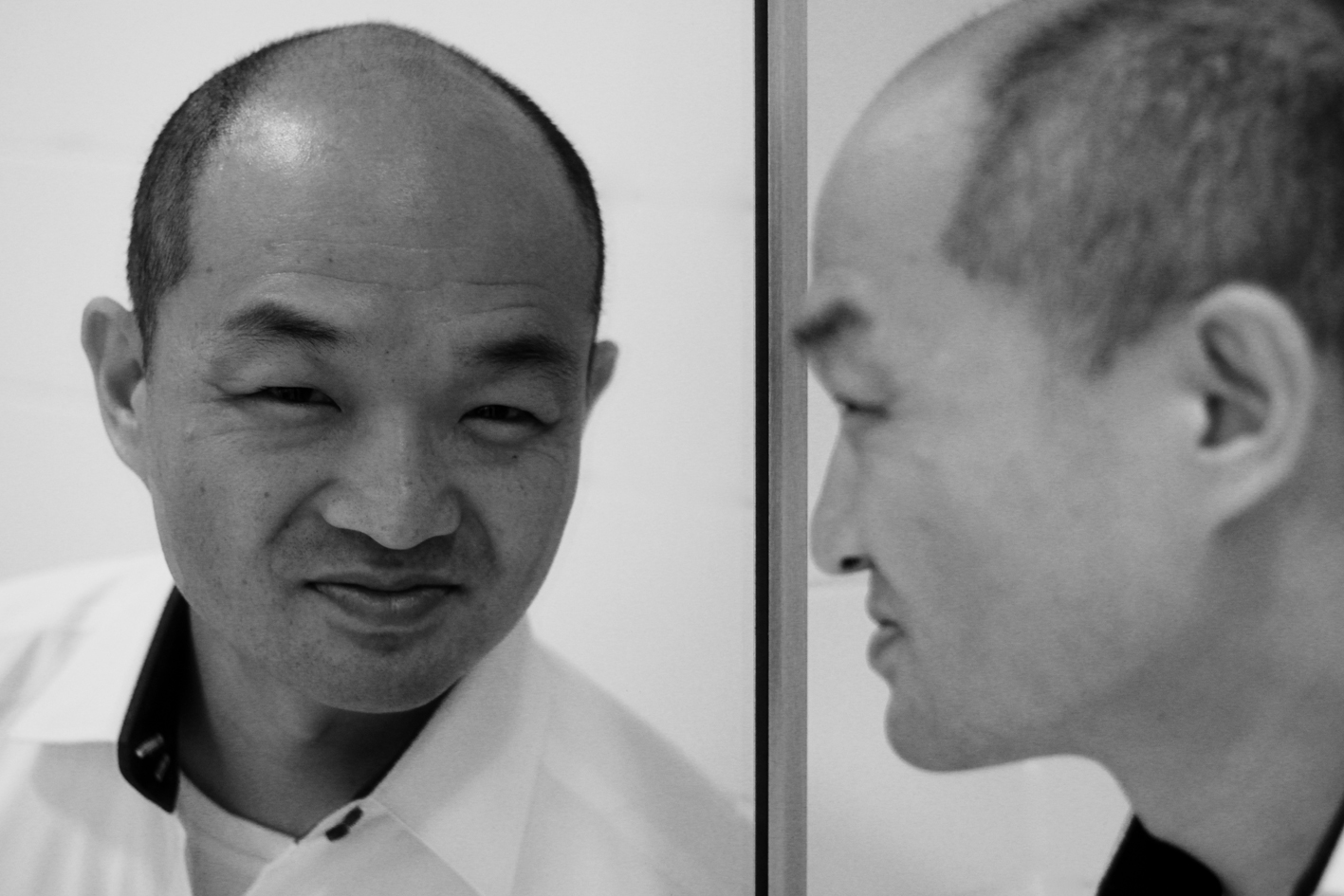 Philip Kim's reflection in the mirror