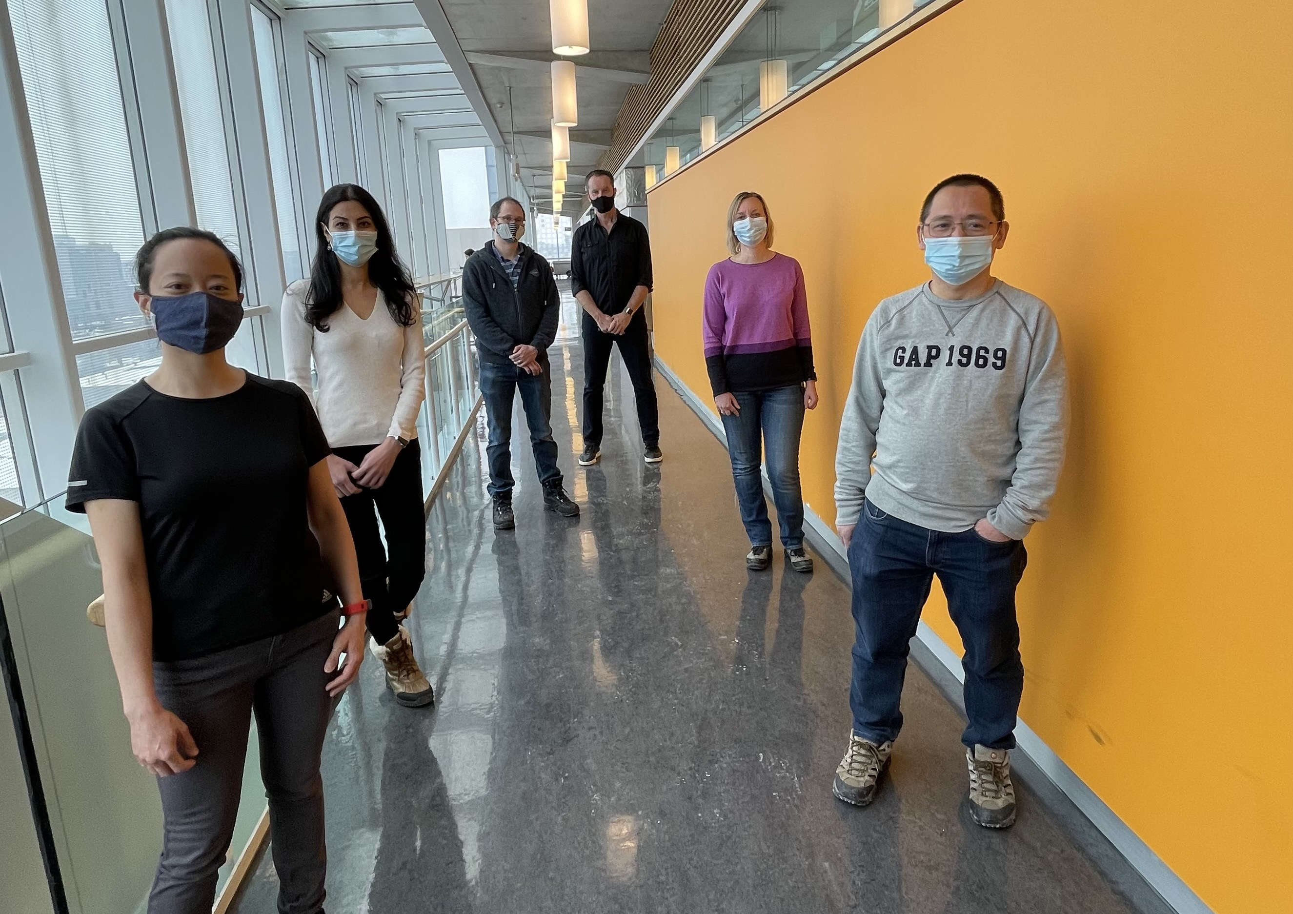 Stagljar lab members standing physically distanced outside their lab